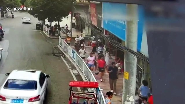Shocking moment billboard collapses on passersby, injuring five