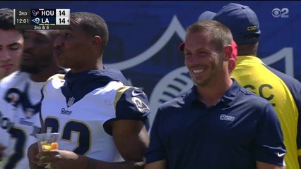 Marcus Peters eats a fruit cup on sidelines