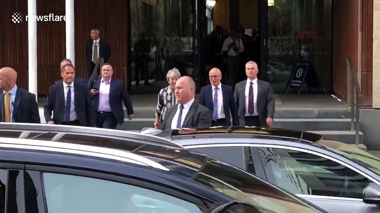 Theresa May puts on brave face after being met with chorus of boos in Edinburgh