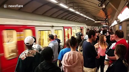 Notting Hill revelers crowd King's Cross station