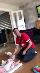 dad gags whilst changing baby s nappy