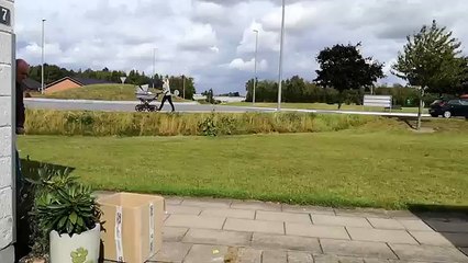 Dad  trying to be cool playing on his sons scooter