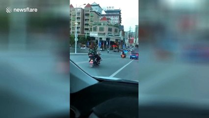 Five women seen balancing precariously on scooter in southern Chinese province