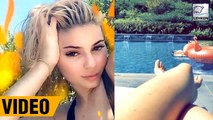 Kylie Jenner Flaunts Cleavage In Low-Cut Swimsuit & Hangs Out Poolside With Pals