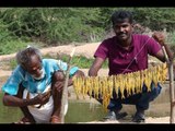 Traditional style fire fish prepared by my daddy / Village food factory