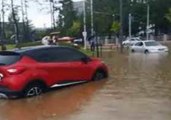 Cars Drive Through Flooded Streets in Daejeon, South Korea