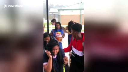 Girl yanks off new wig in heavy downpour before making hilarious dash for car