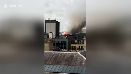 Video from roof of nearby building shows blaze