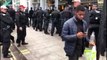 Police detain men outside Caffe Nero during Notting Hill Carnival