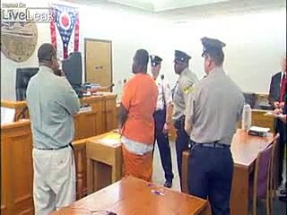 CRAZY MAN CHARGED IN OFFICER'S DEATH CREATES SCENE IN COURT