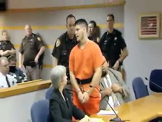 COP-KILLER SUSPECT LUNGES AT VICTIM'S FAMILY