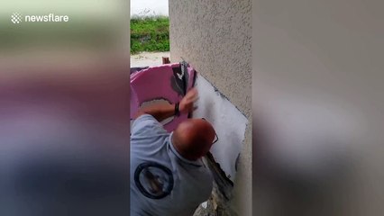 Animal control rescues three-feat-long snake hidden beneath wall