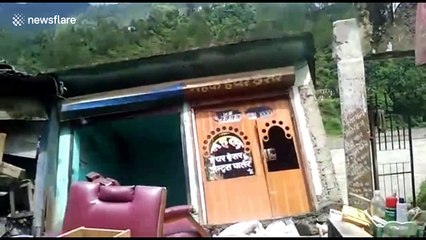 Landslide wipes out building just inches from villagers