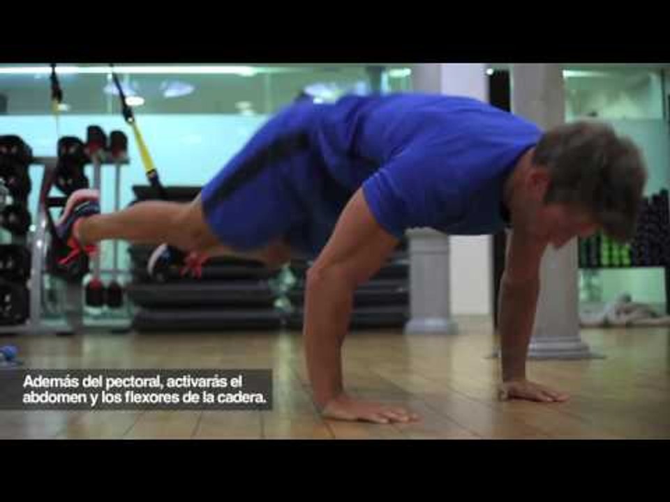 Flexiones con flexión de cadera en TRX