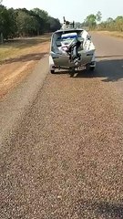 Man Tows Boat on Bike