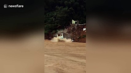 Moment home in Vietnam is swept away amid heavy landslides