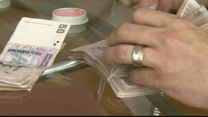 Argentina economy; Thousands protest as peso tumbles