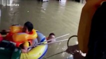 Firefighters rescue senior citizens from flooded house in southern China