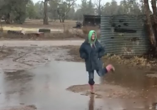 Woman Rejoices as Heavy Rains Drench Drought-Stricken Paddocks in Caroona