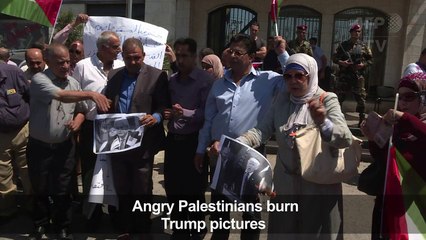 Palestinians burn Trump's picture outside the "American House"