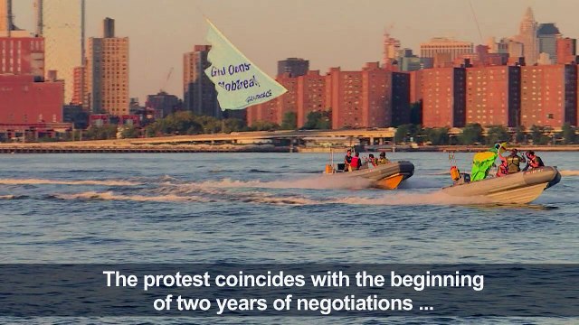 Greenpeace activists fly banners ahead of UN talks on high seas