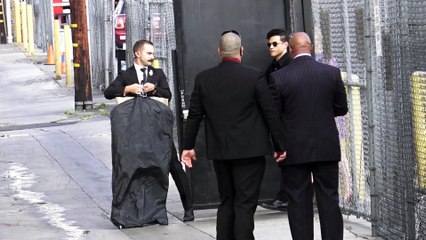 Rami Malek waves to fans outside Jimmy Kimmel Live at El Capitan Theater in Hollywood