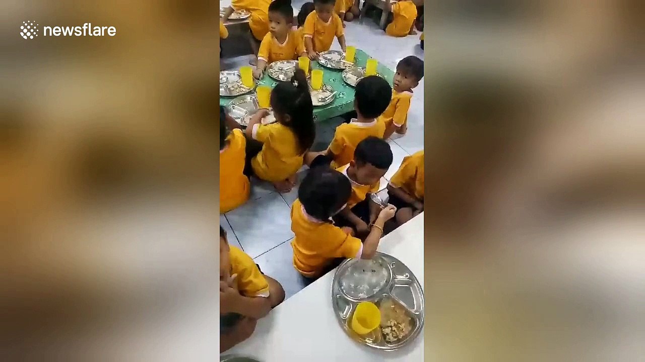 Heartwarming moment big sister feeds little brother on first day at school