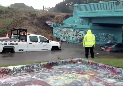 Car Gets Stuck in Floodwaters Under Pensacola's 'Graffiti Bridge'