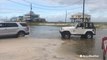 Stranded car pulled out of sand during Gordon flooding