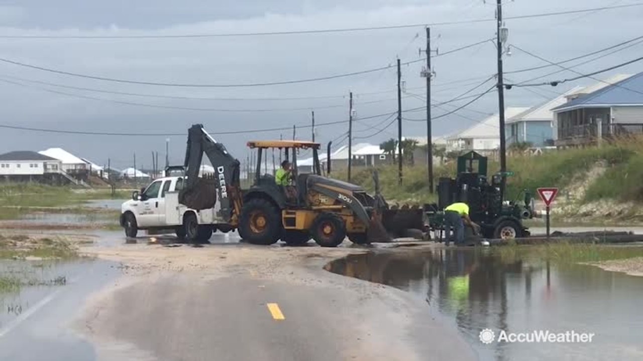 Floodwaters and sand getting cleared in Dauphin Island, Alabama