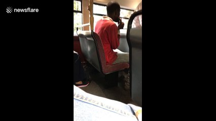 Shocked morning commuter films man 'smoking crack pipe' on top deck of London bus