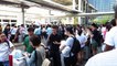 Thousands of stranded passengers and airport employees queue for shuttle services out of Kansai Airport island