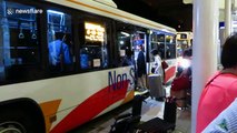 Stranded passengers board shuttle out of Kansai Airport island after hours-long wait