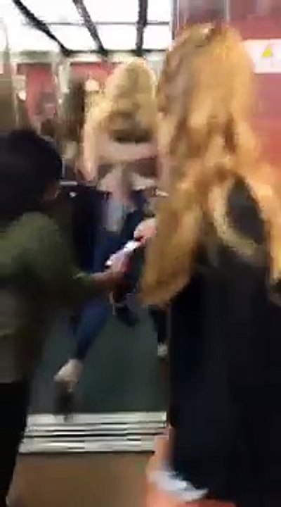 girl tries to moonwalk into the lift but the door closes on her and she falls over
