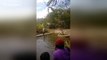 Visitors pay $2 to watch man force ducks down water slide in Vietnam