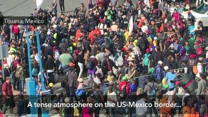 Download Video: Migrants push on to US-Mexico border bridge as US holds drills