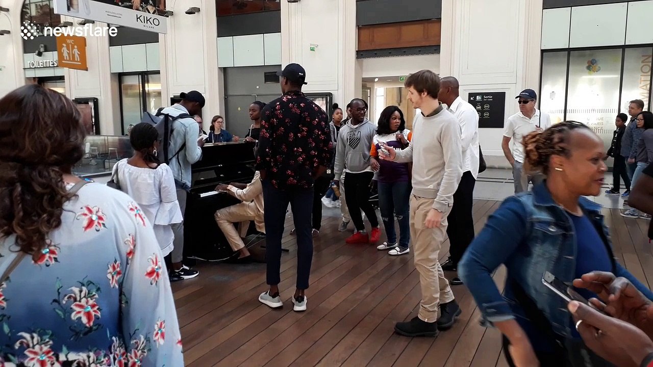 Gospel singers lift spirits at Paris train station