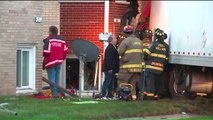 Driver Rescued After Semi Crashes Into Apartment Building in Illinois