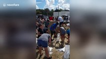 Residents fill up sand bags as Hurricane Florence heads towards the Carolinas
