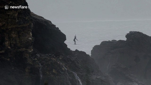 Daredevil slacklines over monster waves in Nazare, Portugal