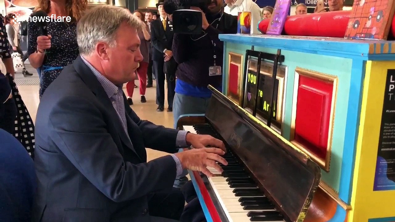 Ed Balls plays piano at Leeds station