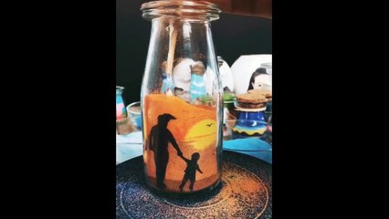 Very beautiful Painted in sand with a bottle