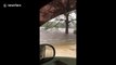 Residents drive through flooded roads as Hurricane Florence nears Carolina coast