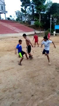 Kid are playing a football