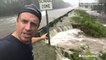 Reed Timmer at a road in danger of getting washed out by flooding