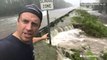 Reed Timmer at a road in danger of getting washed out by flooding