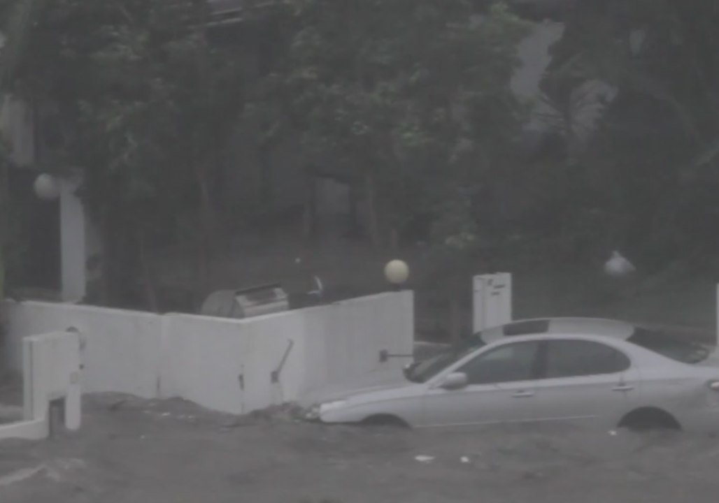 Car Floats in Flood Water as Typhoon Ravages Hong Kong