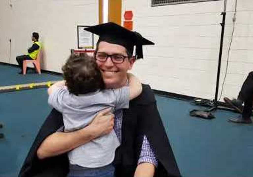 Adorable Toddler Cheers on Father as He Graduates College