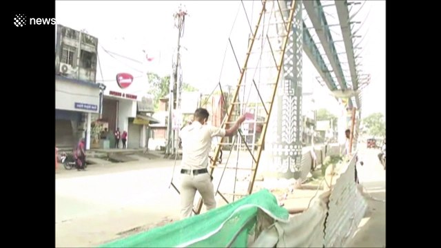 Moment heroic traffic cop saves 'suicidal' man from bridge in India