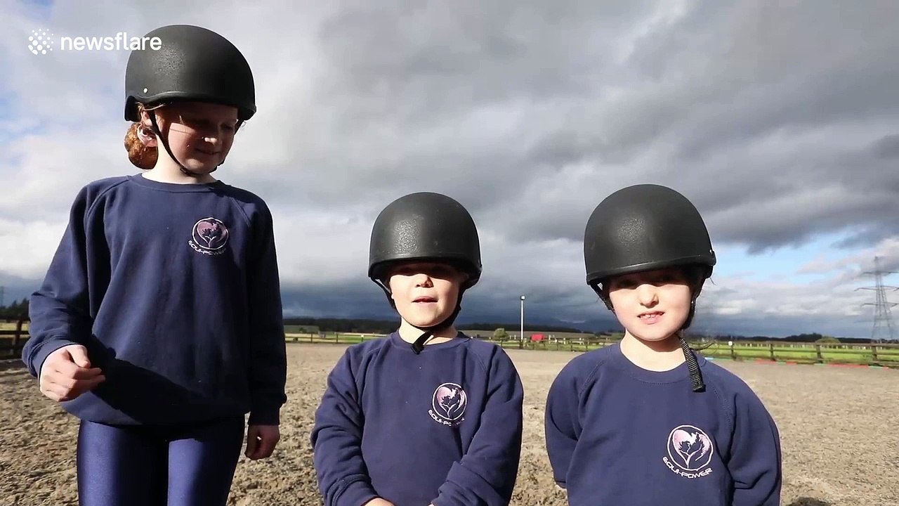 Children with disabilities perform gymnastics o...